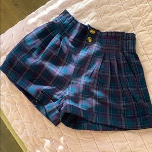 Dark blue plaid printed trouser shorts.
